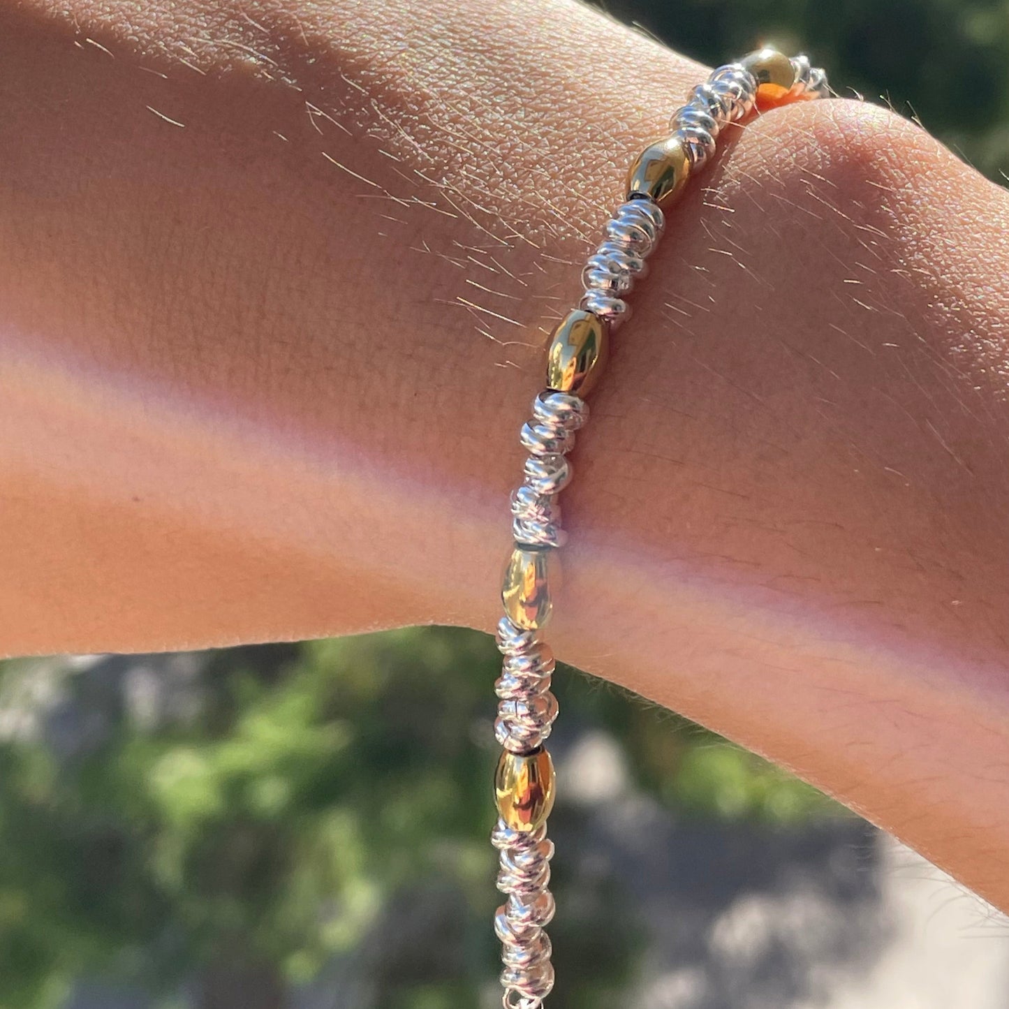 Bracciale perline ovali in 2 colori