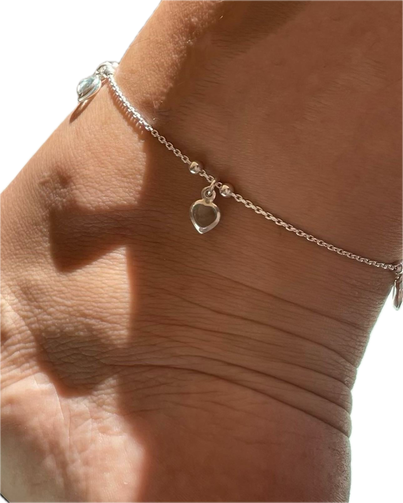 Cavigliera con cuori pendenti in 3 colori