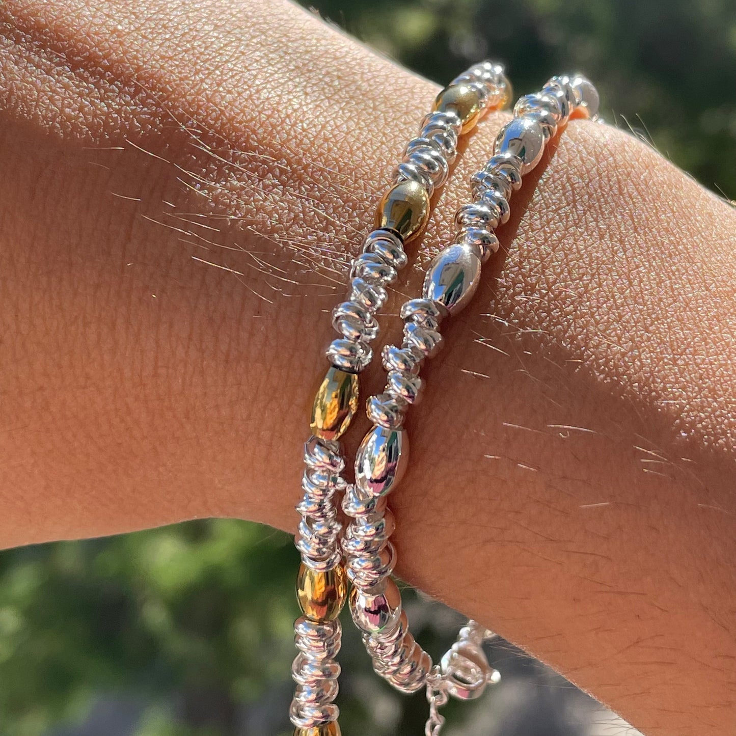 Bracciale perline ovali in 2 colori