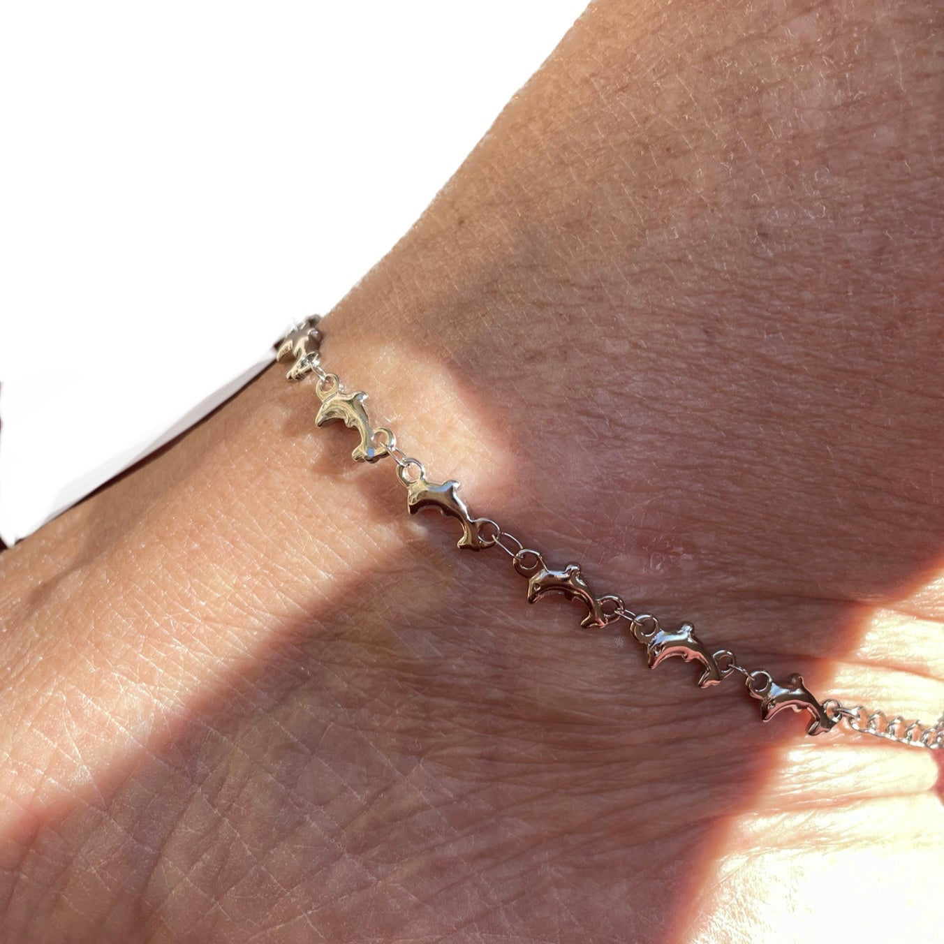 Cavigliera con delfini in 2 colori