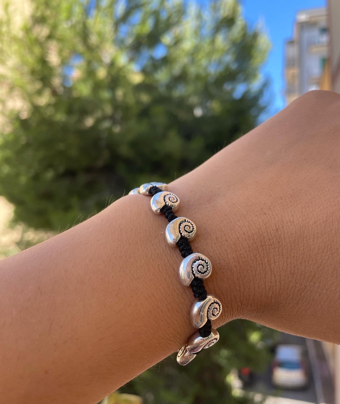 Bracciale con charm in 5 fantasie