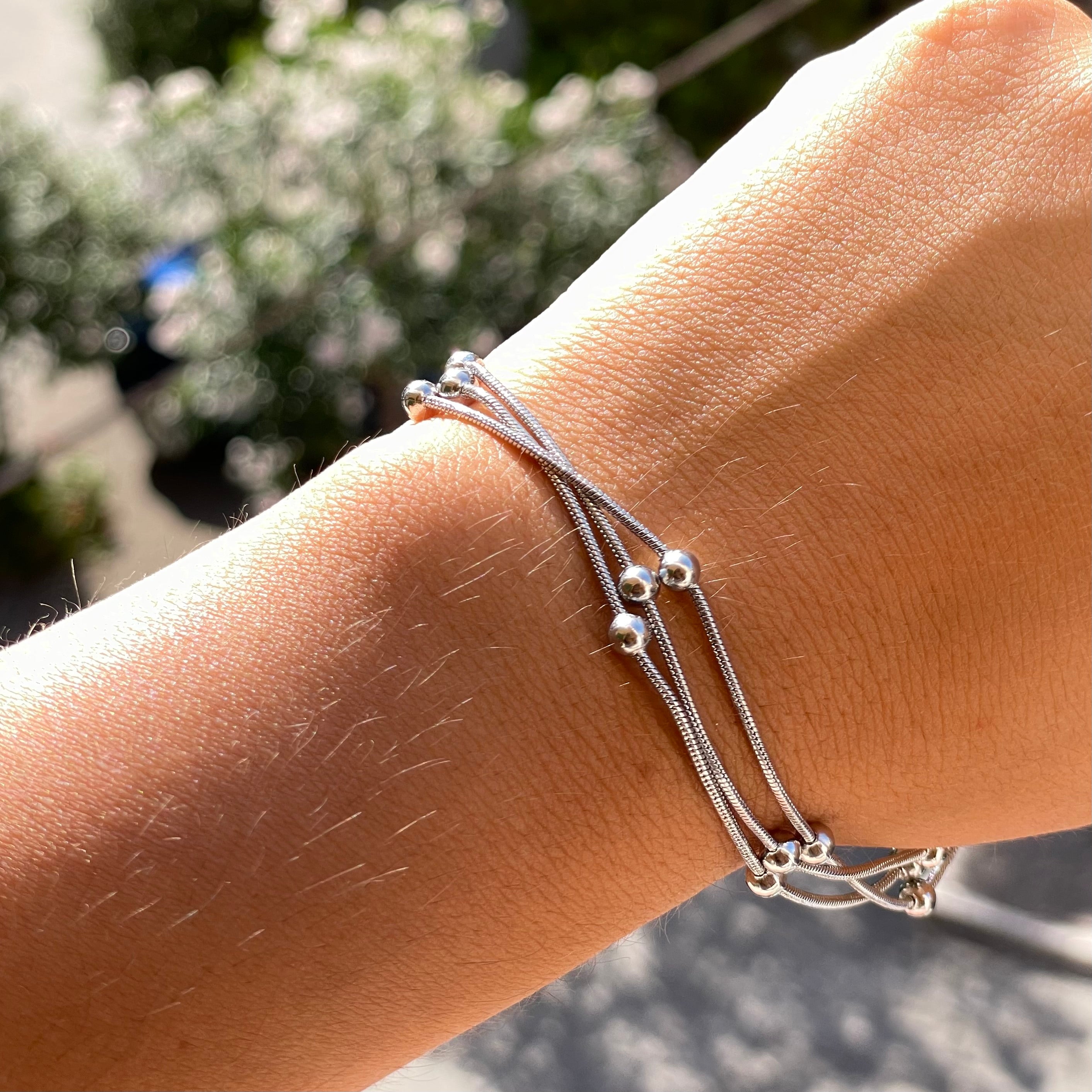 Bracciale pallini a tre in 2 colori