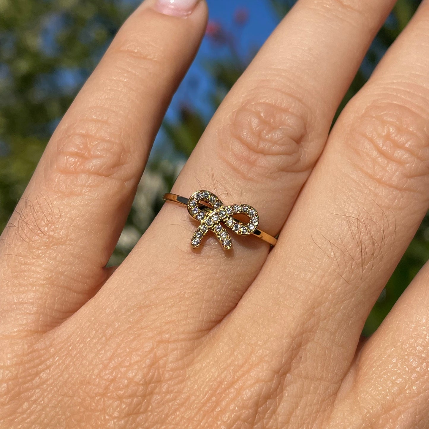Anello fiocco glitter in 2 colori