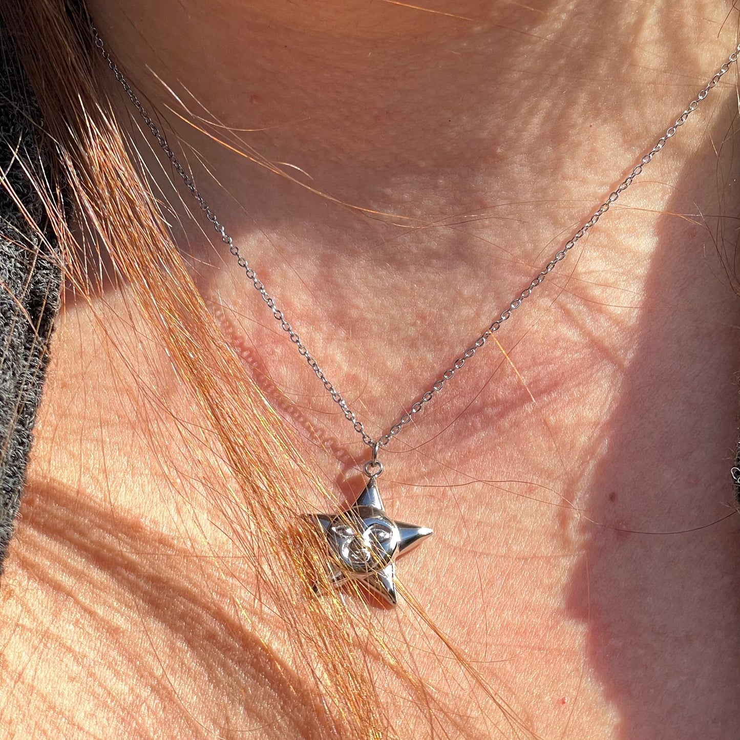 Collana stella con viso in 2 colori