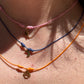 Collana colorata con charmimini in 7 colori