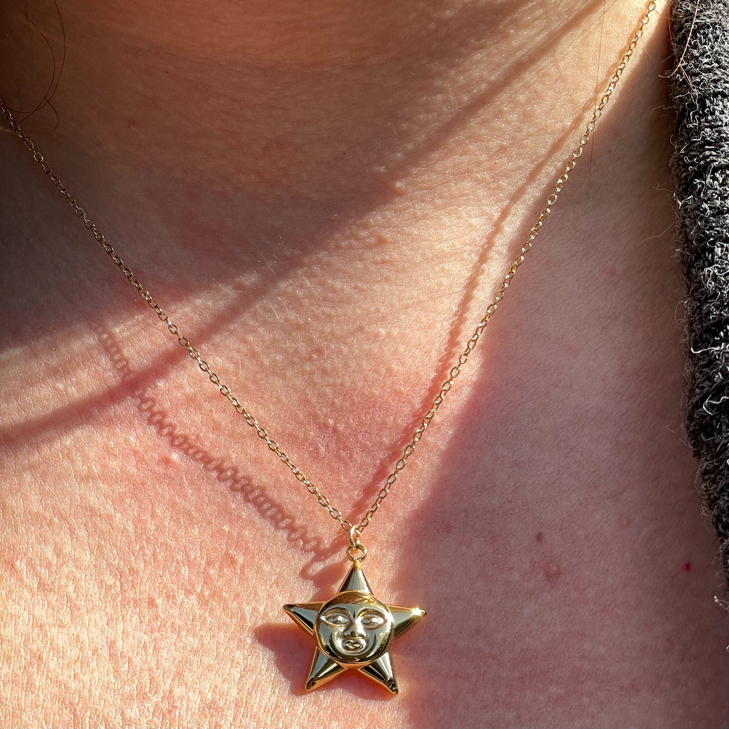 Collana stella con viso in 2 colori