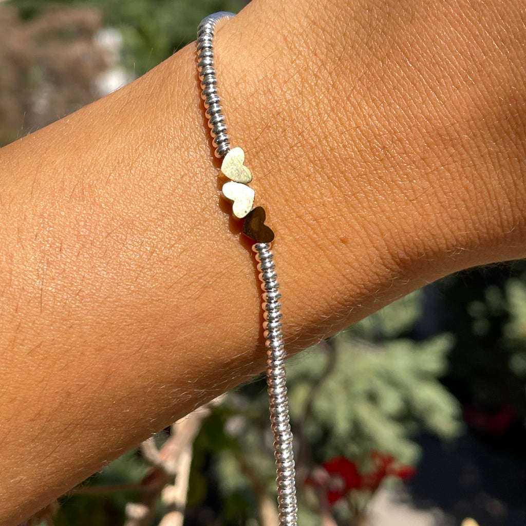 Bracciale tre cuori in 2 colori