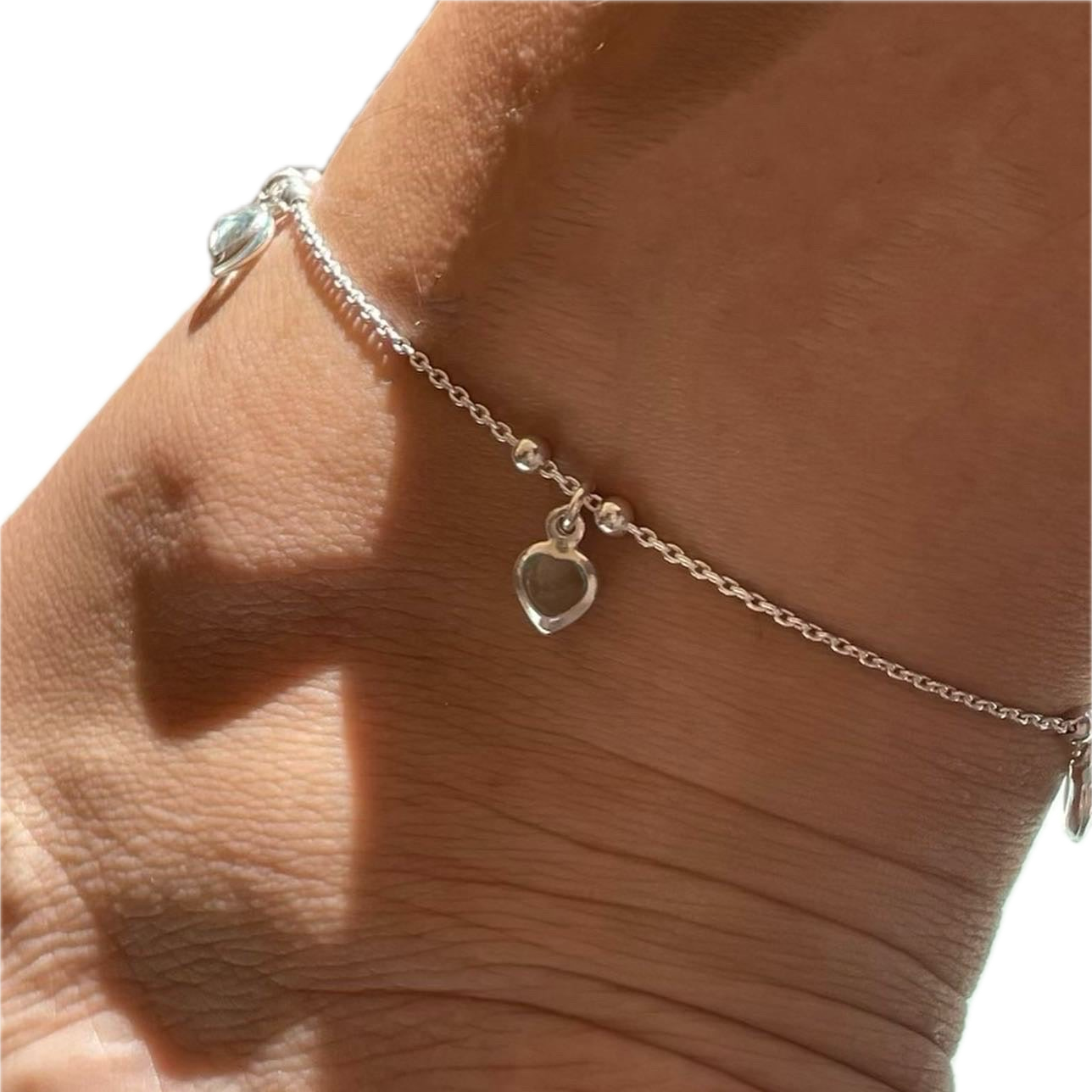 Cavigliera con cuori pendenti in 3 colori