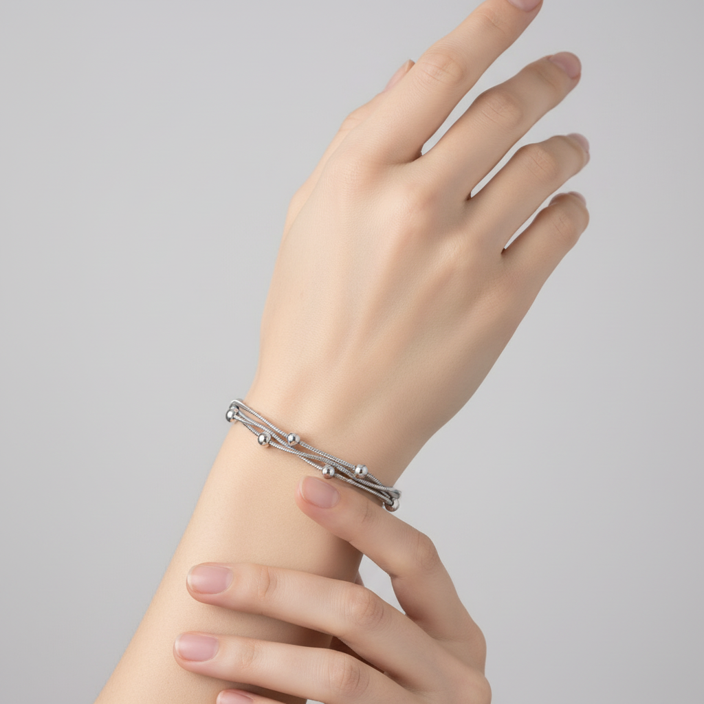 Bracciale pallini a tre in 2 colori