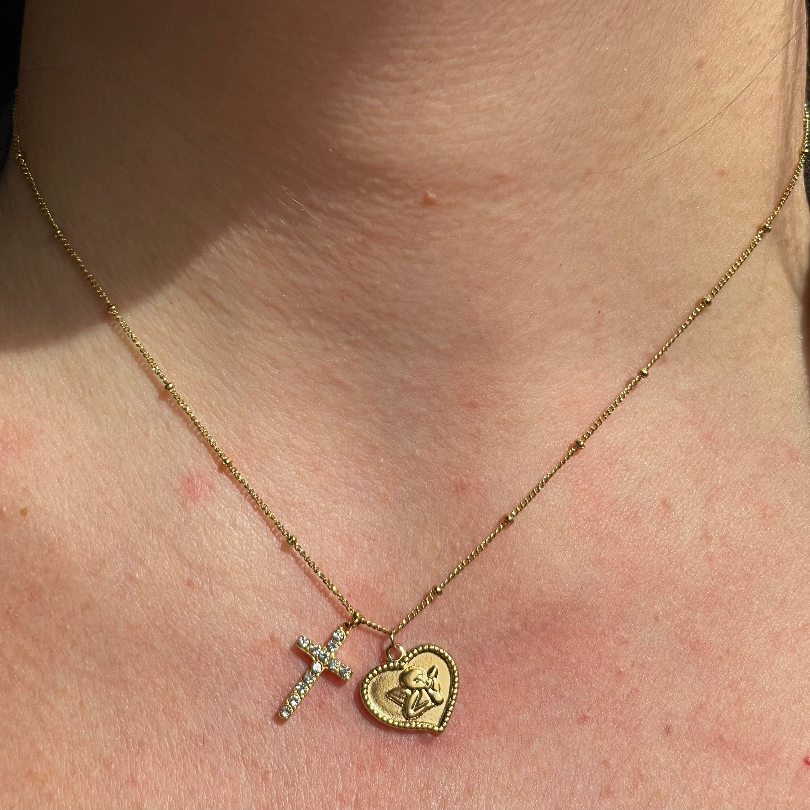 Collana con angelo e croce in 2 colori