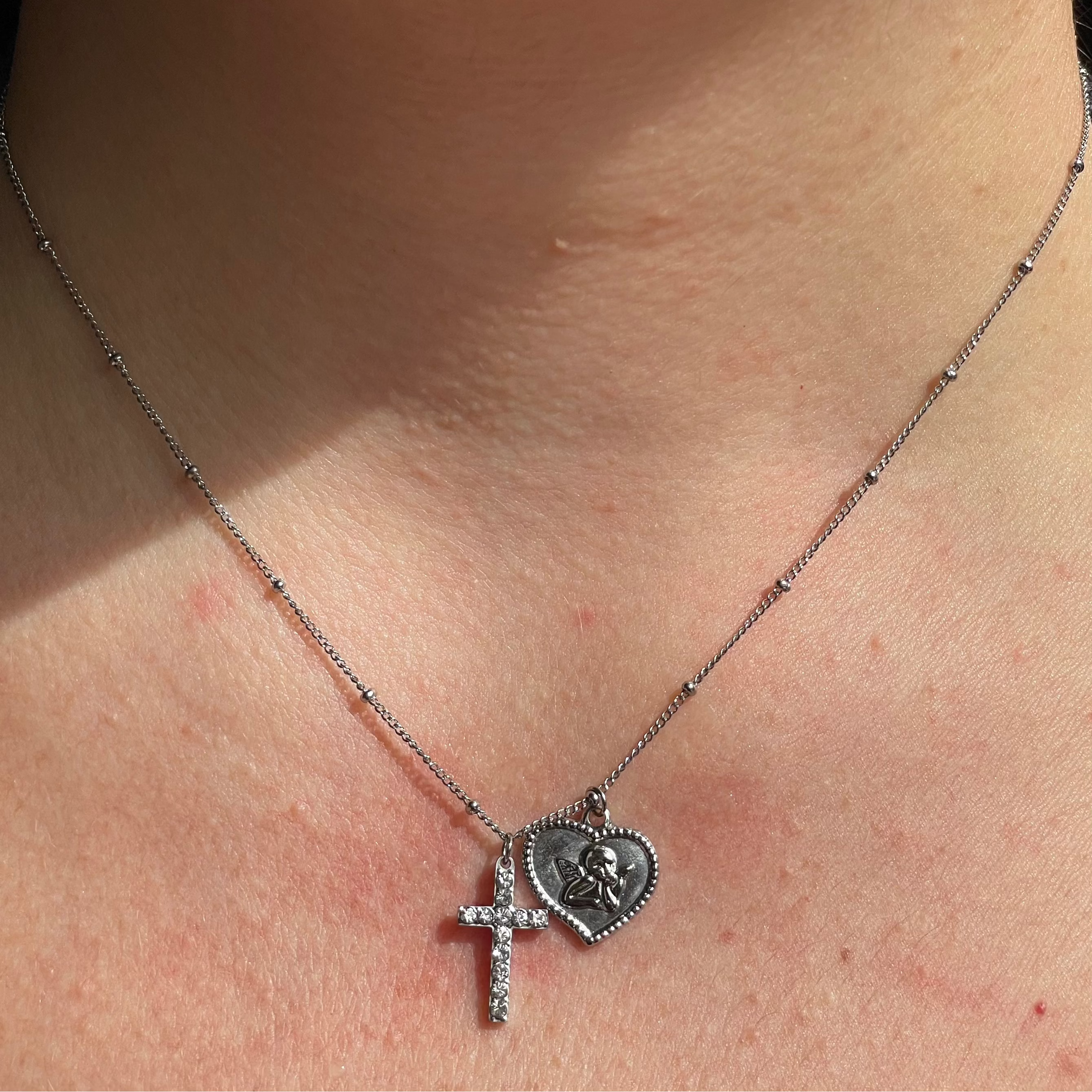 Collana con angelo e croce in 2 colori
