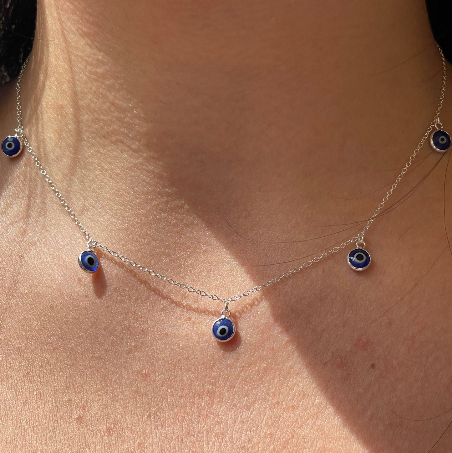 Set collana, bracciale e orecchini con occhio di Allah blu