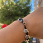 Bracciale con charm in 5 fantasie