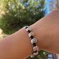 Bracciale con charm in 5 fantasie