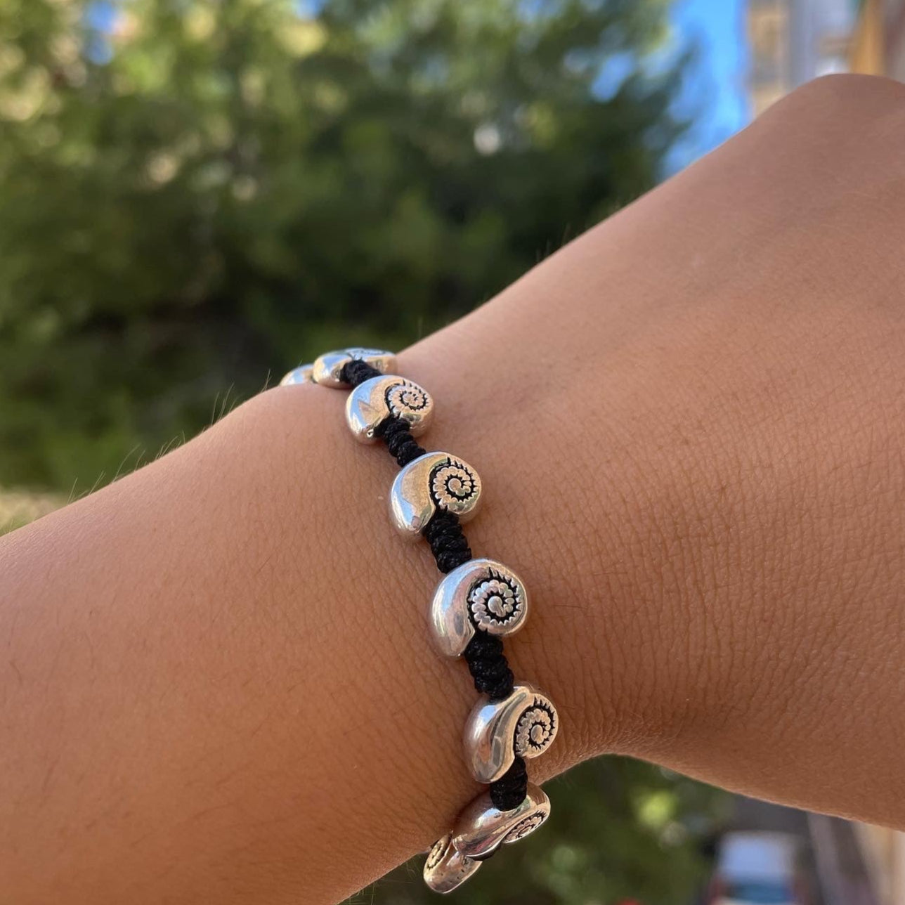 Bracciale con charm in 5 fantasie