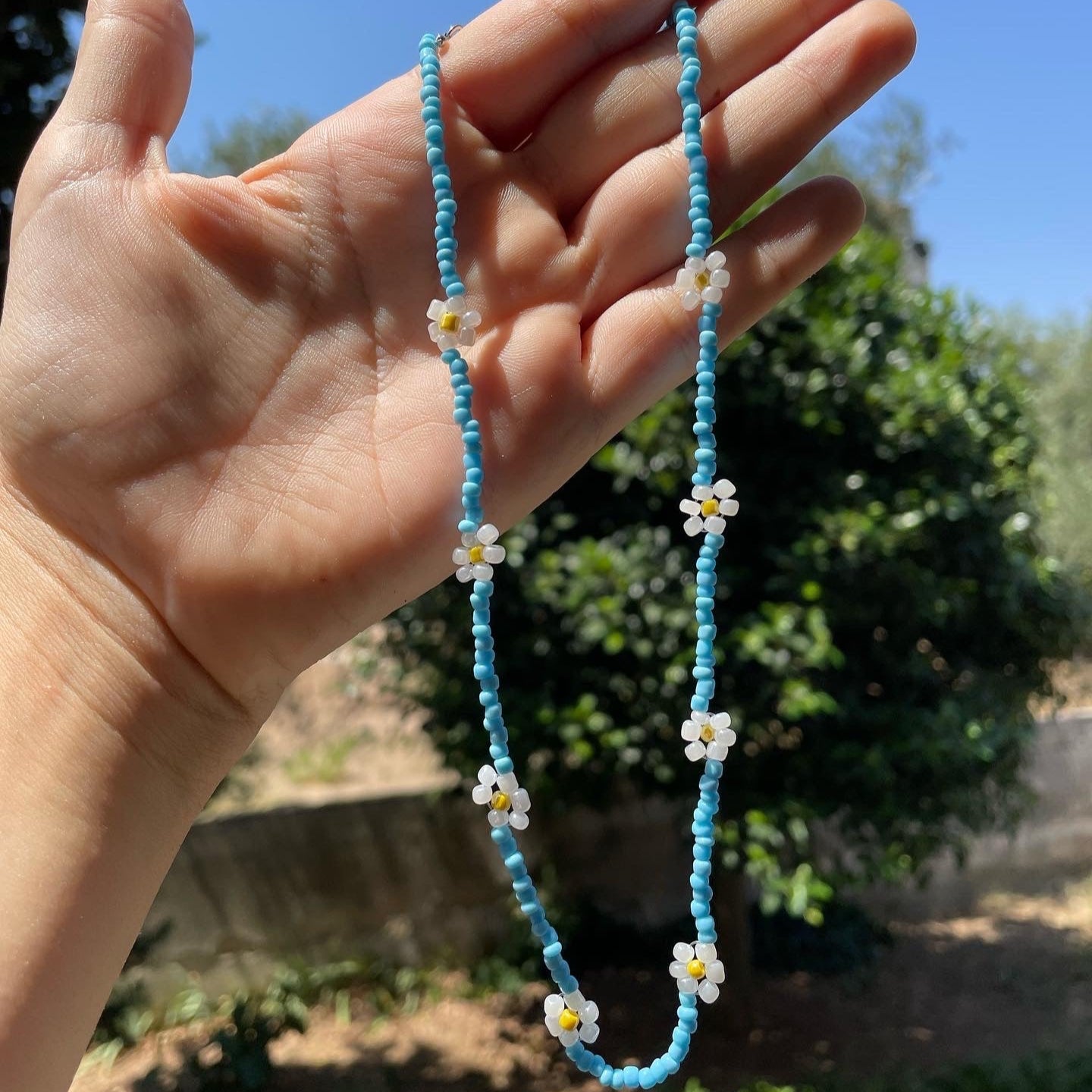 Collana con perline e fiori in 7 colori