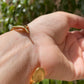 Bracciale rigido con piuma
