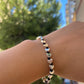 Bracciale con charm in 5 fantasie