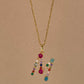 Collana lettera con pietre colorate