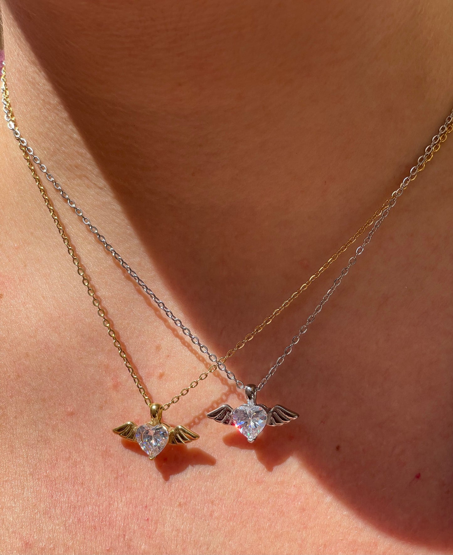 Collana con cuore e ali in 2 colori