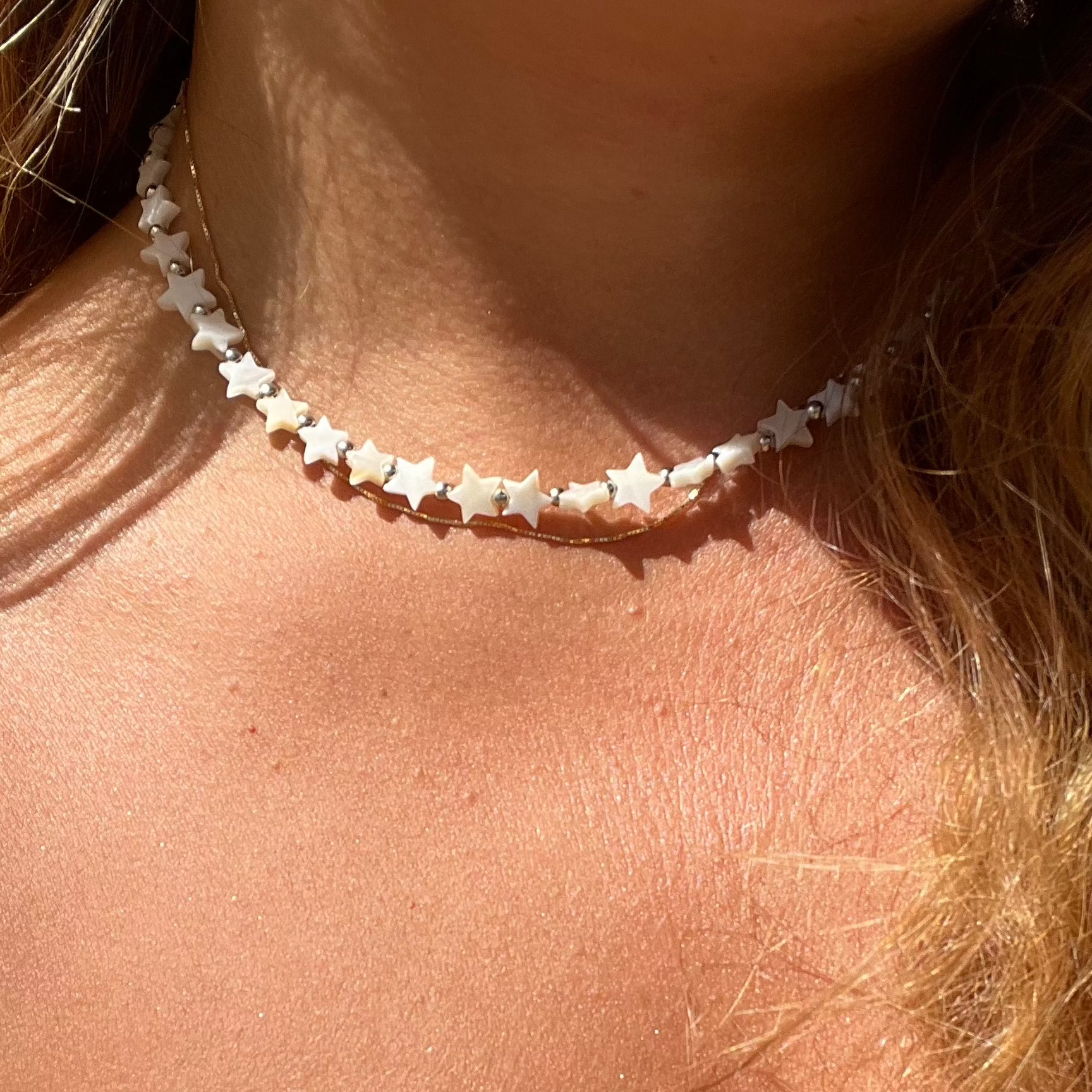 Collana con stelle in madreperla in 2 colori