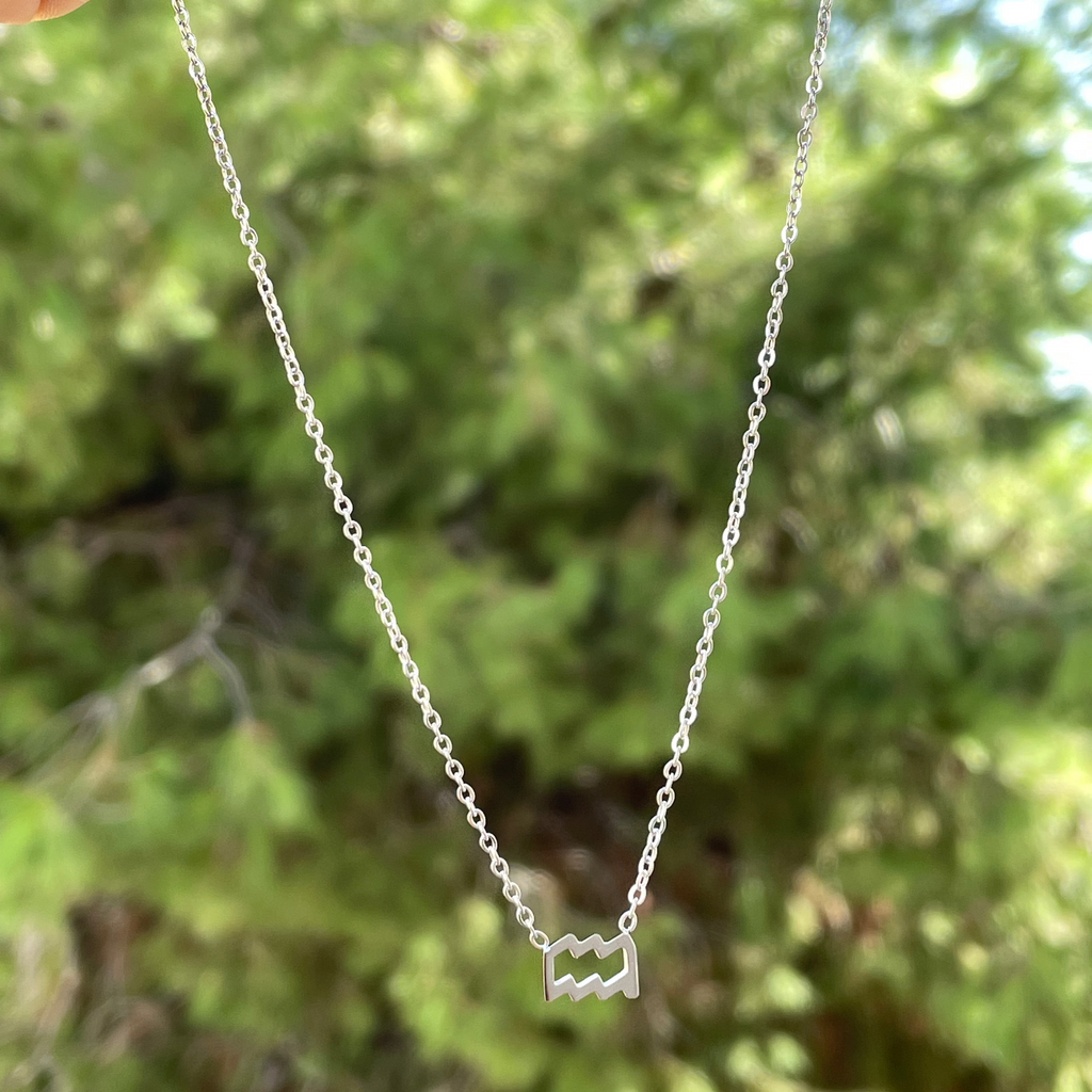 Collana con segno zodiacale in 2 colori