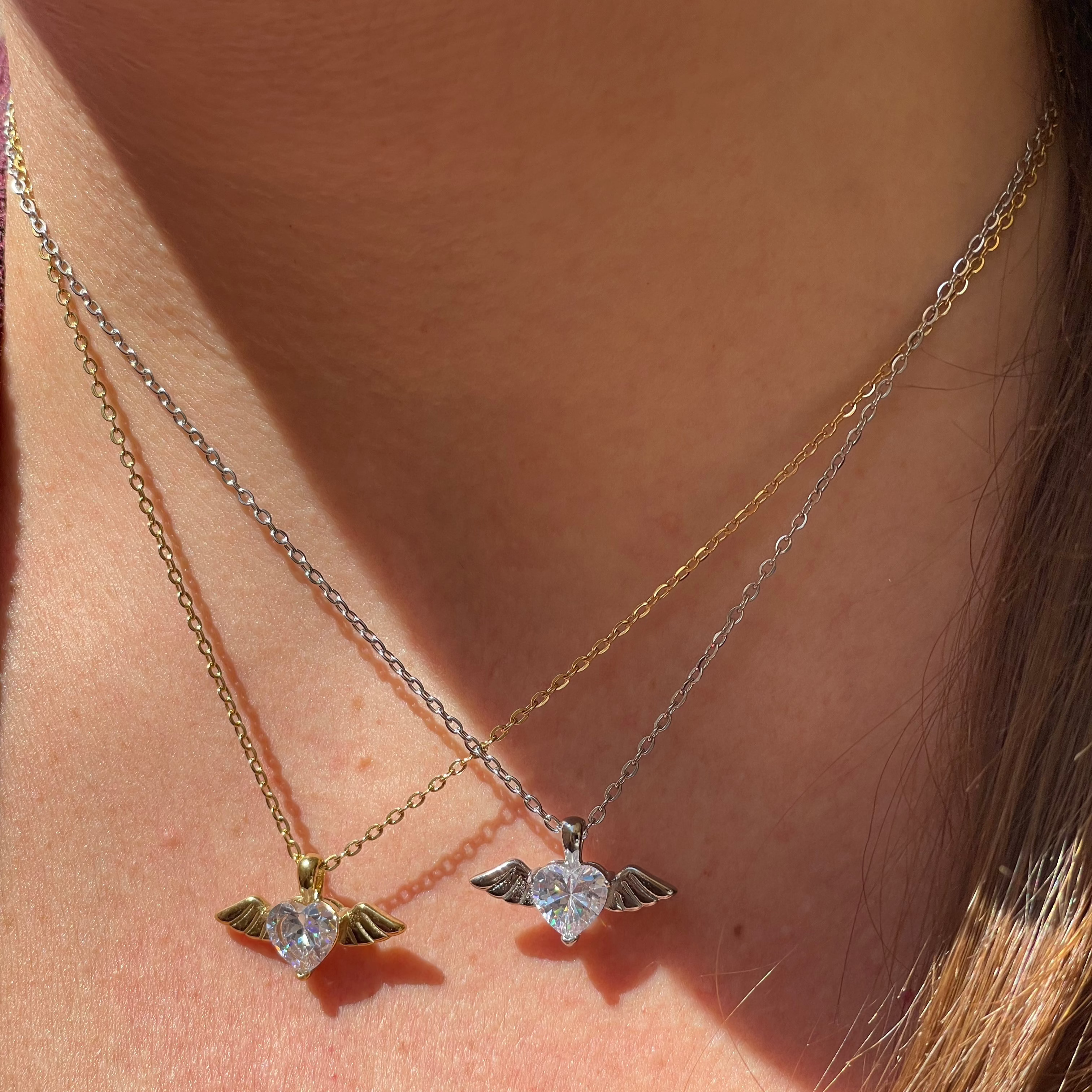 Collana con cuore e ali in 2 colori